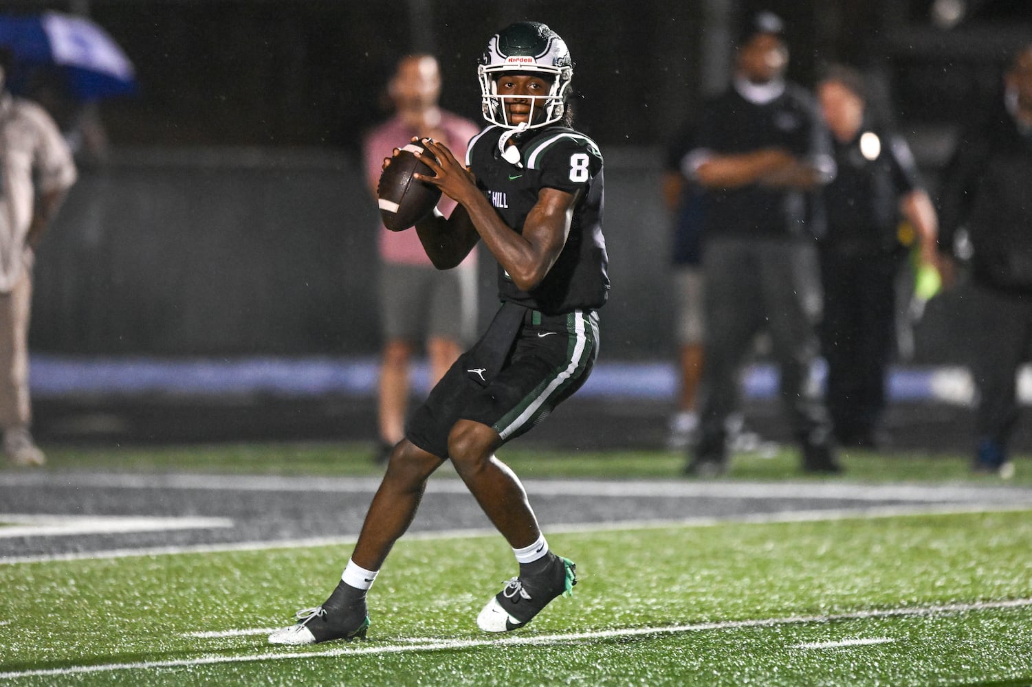 Collins Hall quarterback Makyree Cross drops back for a pass against Grayson during the first half of play Friday, August 15, 2025. (Daniel Varnado for the AJC)