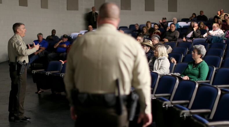 January 12, 2016 Woodstock: Cherokee County Sheriff’s Department Chief Deputy Joe Perkins, left, and Deputy Jeremy Herrin lead an active shooter seminar Tuesday evening January 12, 2016 at Etowah High School. Ben Gray / bgray@ajc.com
