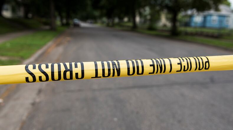 A piece of police tape is strung across a street in Minneapolis, Minnesota on June 24, 2018.