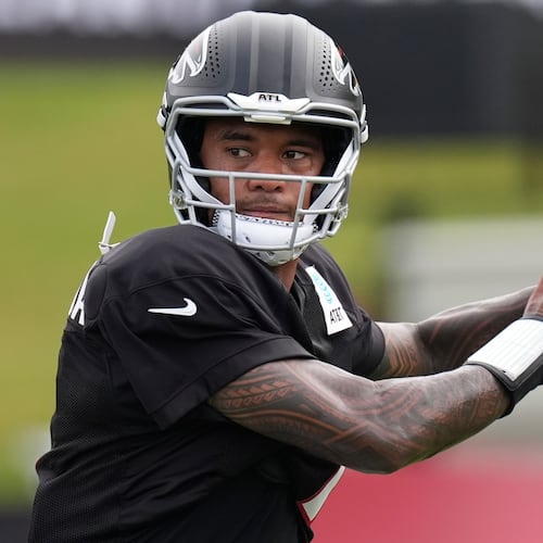 Atlanta Falcons quarterback Tua Tagovailoa (1) works out during an NFL training camp, Friday, Aug. 7, 2026, in Flowery Branch, Ga. (AP Photo/Mike Stewart)