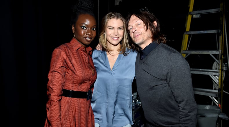 NEW YORK, NEW YORK - OCTOBER 05: (L-R) Danai Gurira, Lauren Cohan, and Norman Reedus pose backstage at a panel for AMC's The Walking Dead Universe including AMC's flagship series and the untitled new third series within The Walking Dead franchise at Hulu Theater at Madison Square Garden on October 05, 2019 in New York City. (Photo by Jamie McCarthy/Getty Images for AMC)