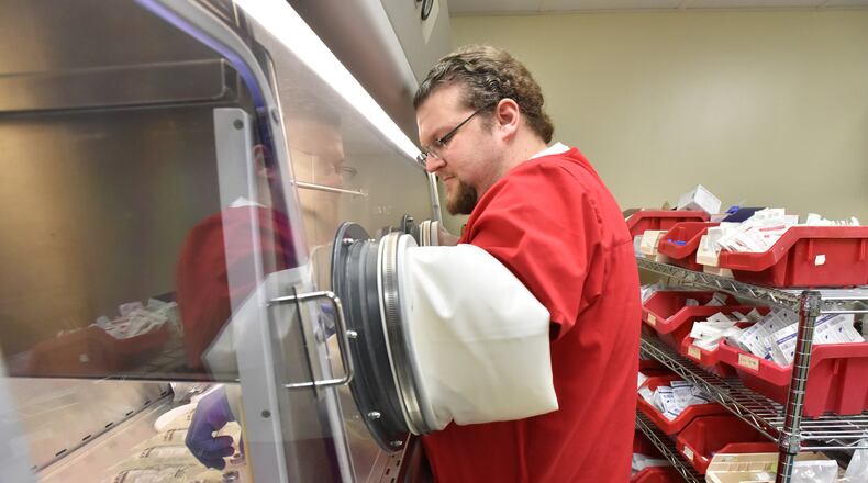 Calvin Lane prepares medications for patients at Wayne Memorial Hospital in Jesup, near the Georgia coast. The hospital treats patients in a multicounty area, and with 500 workers, it is easily one of the area’s largest employers. The legislative session about to begin has big financial implications for hospitals such as Wayne Memorial and across Georgia. PHOTO by HYOSUB SHIN / HSHIN@AJC.COM