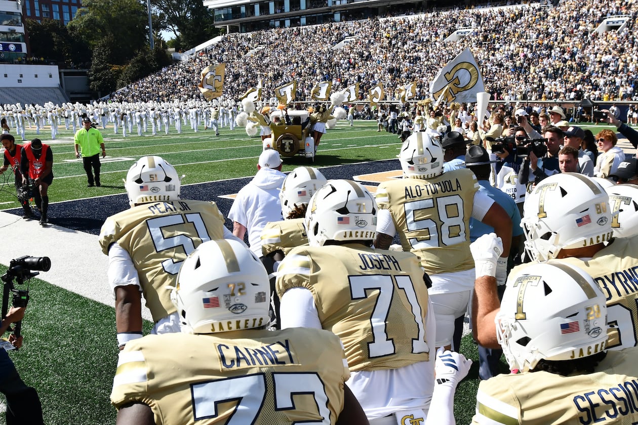 Georgia Tech’s Ramblin’ Wreck leads players and coaches onto the field before their game against Syracuse at Bobby Dodd Stadium on Saturday, Oct. 25, 2025, in Atlanta. This week the Yellow Jackets play NC State. (Hyosub Shin/AJC)
