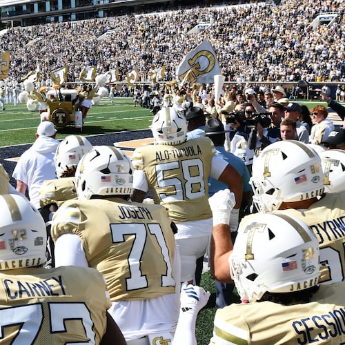 Georgia Tech’s Ramblin’ Wreck leads players and coaches onto the field before their game against Syracuse at Bobby Dodd Stadium on Saturday, Oct. 25, 2025, in Atlanta. This week the Yellow Jackets play NC State. (Hyosub Shin/AJC)