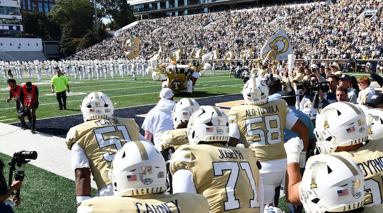 Georgia Tech’s Ramblin’ Wreck leads players and coaches onto the field before their game against Syracuse at Bobby Dodd Stadium on Saturday, Oct. 25, 2025, in Atlanta. This week the Yellow Jackets play NC State. (Hyosub Shin/AJC)