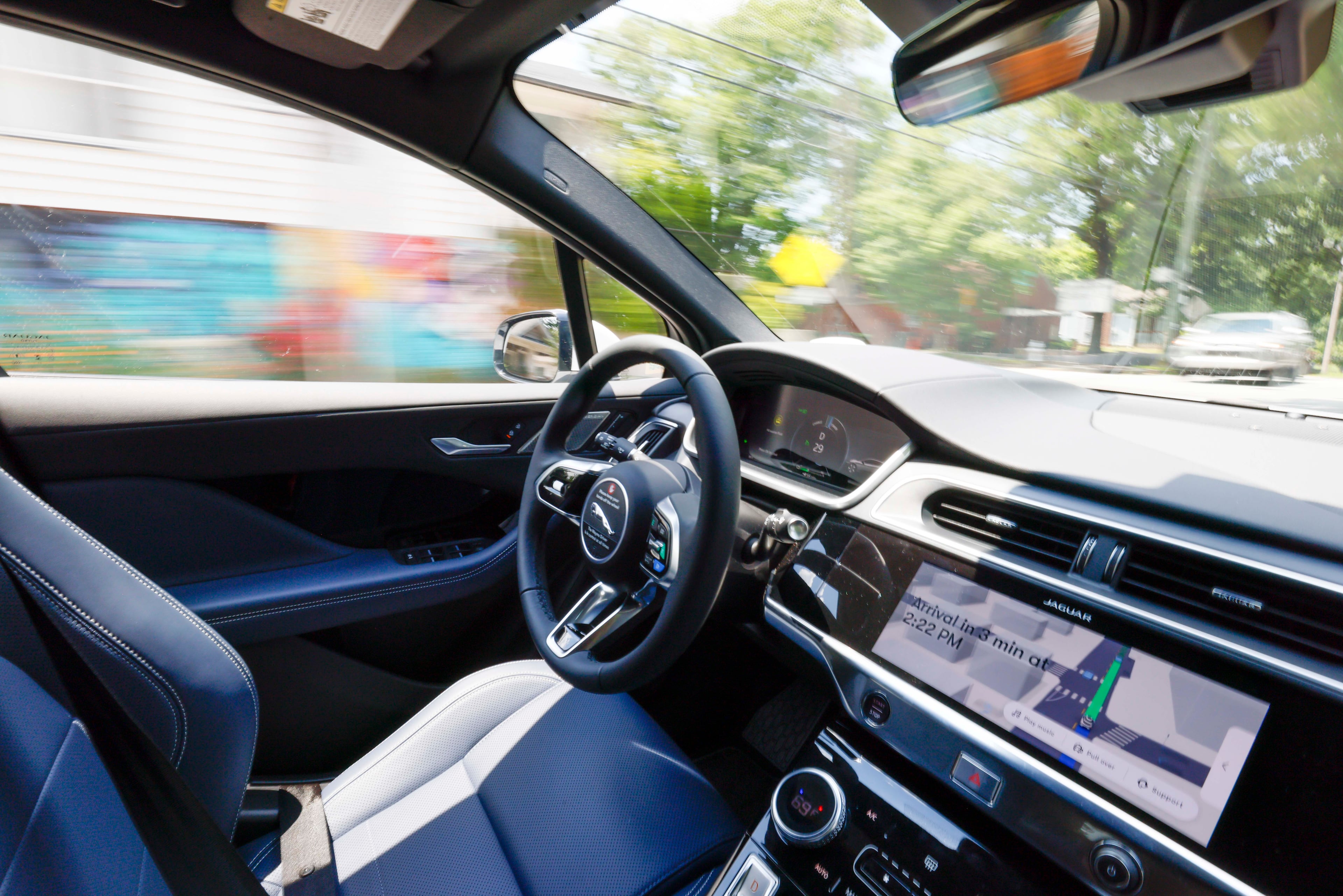 A photograph of a self-driving Waymo vehicle in motion during a self-test drive on Monday, June 23, 2025. (Miguel Martinez/AJC)