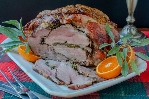 Pork Shoulder Porchetta is a budget-conscious, spectacular main course for the holidays. (Virginia Willis for The Atlanta Journal-Constitution)