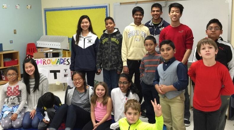 Members of Student Leadership Johns Creek perform a variety of community service projects, including working with youngsters at Shakerag Elementary. Contributed.