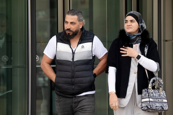 Odai Al Fayoumi, left, father of Wadee Al Fayoumi, who was murdered by Joseph Czuba in 2023, walks out of the Will County Courthouse after the sentencing of Czuba in Joliet, Ill., Friday, May 2, 2025. (Pat Nabong /Chicago Sun-Times via AP)