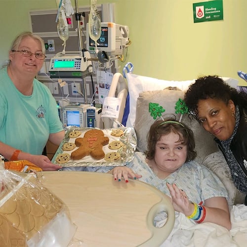 Latrice Moore (right), a 52-year-old grandmother from Paulding County, works as a volunteer Fairy Godparent for Bert's Big Adventure, where she interacts with children in the hospital. Moore has been named a “Difference Maker” for 2025 by Gas South, along with Zac Potter, a volunteer with the City of Refuge after-school program, and Melissa Kinard, who helps families seeking assistance at the St. Vincent de Paul Catholic charity in Lawrenceville. (Courtesy of Gas South)