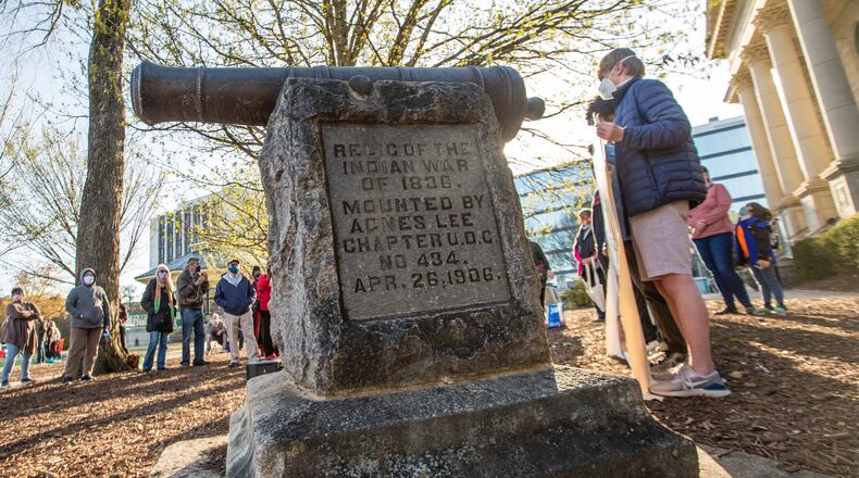 A rally in support of removal of a cannon in Decatur Square gathers Saturday, March 20, 2021.  The war relic serves as a monument in DeKalb County marking the end of the 1836 "Indian War."  Speakers from various groups note the oppression and forced removal of Native Americans and call for the cannon that was used against them to be removed.  (Jenni Girtman for The Atlanta Journal-Constitution)