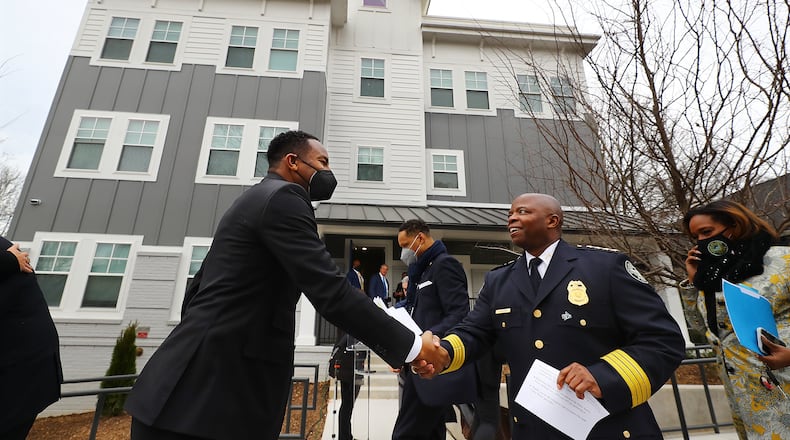 020222 Atlanta: Atlanta Mayor Andre Dickens and Police Chief Rodney Bryant greet each other as they arrive at the ribbon cutting for Unity Place, which is being called the nation's first apartment complex for Atlanta Police recruits on Wednesday, Feb. 2, 2022, in Atlanta. “Curtis Compton / Curtis.Compton@ajc.com”`