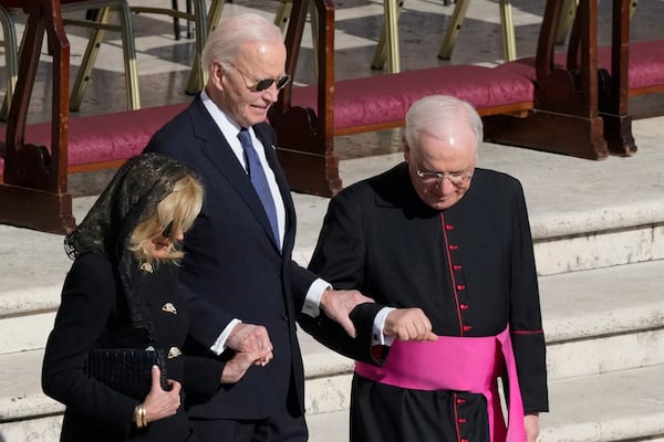 Former President Joe Biden, center, and his wife Jill arrive for the funeral of Pope Francis in St. Peter's Square at the Vatican, Saturday, April 26, 2025. (AP Photo/Gregorio Borgia)