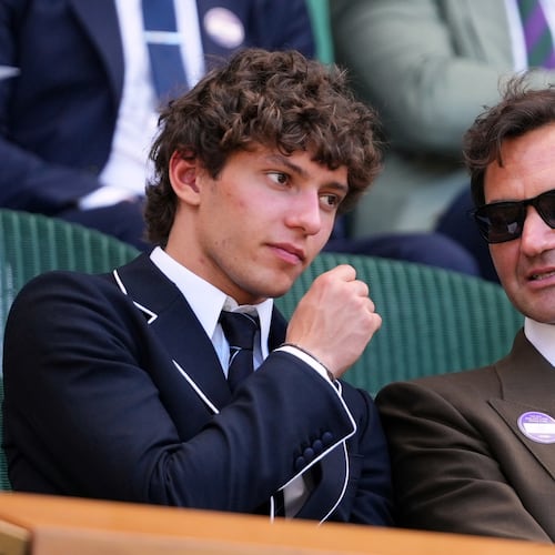 F1 Mercedes driver Andrea Kimi Antonelli of Italy sits beside former tennis player Roger Federer of Switzerland in the Royal Box on day eight at the Wimbledon Tennis Championships in London, Monday, July 6, 2026.(AP Photo/Kirsty Wigglesworth)