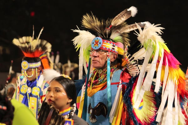 Native American and Indigenous dancers pack an arena during a grand entry procession at the annual Gathering of Nations powwow in Albuquerque, New Mexico, Friday, May 25, 2025. (AP Photo/Susan Montoya Bryan)
