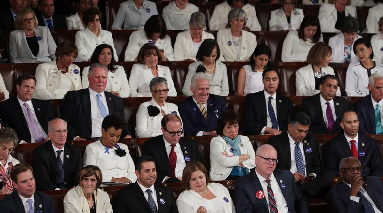 Members of Congress look on as President Donald Trump addresses a joint session on Feb. 28, 2017, in the House chamber of the U.S. Capitol in Washington, D.C.