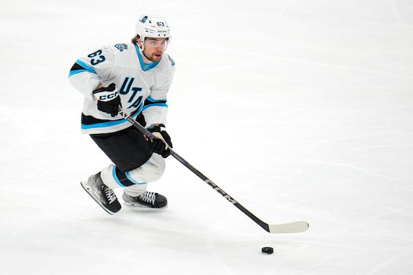 FILE - Utah Hockey Club left wing Matias Maccelli skates with the puck against the Dallas Stars during the third period of an NHL hockey game, Jan. 4, 2025, in Dallas. (AP Photo/Julio Cortez, file)
