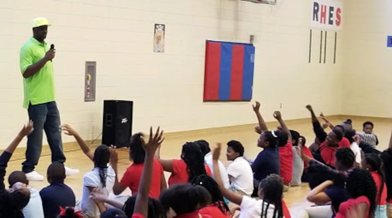 Dontonio Wingfield, a McDonald’s All-American basketball player in 1993 from Albany’s Westover High,  speaks to kids at Henderson Gym, where he grew up playing. Wingfield’s NBA career ended in 1998 when he suffered debilitating injuries in a car crash. For the past 11 years, he has run the Albany Hawks/Pivot mentoring and basketball program in his hometown.