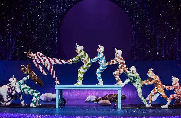 Acrobats play children having a pillow fight in Cirque du Soleil's Christmas show.