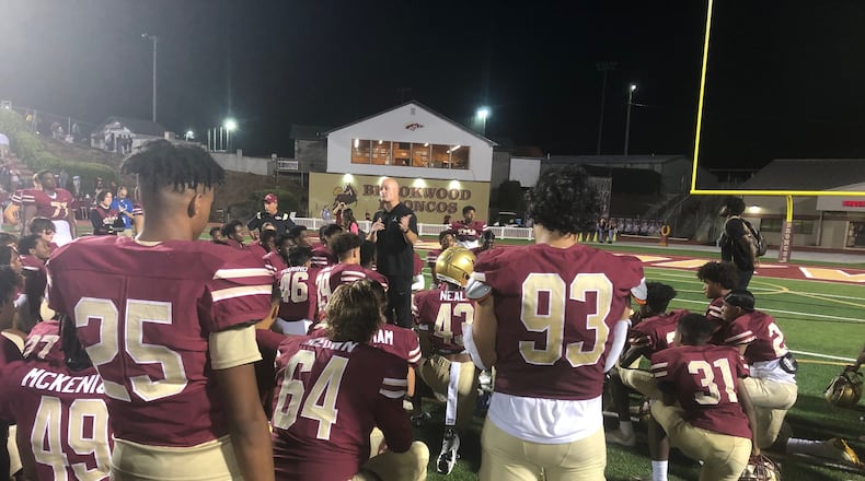 Brookwood coach Philip Jones talks to his team after its 28-6 win over Newton on Oct. 15 at Brookwood Community Stadium.