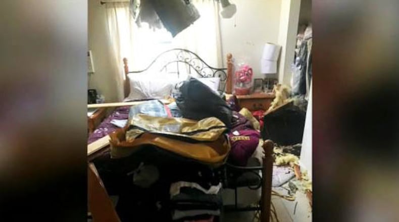 An 80-pound inflatable raft crashed into a Miami home Wednesday after falling off a Royal Canadian Air Force search-and-rescue helicopter, authorities said. (Photo: WFTV.com)