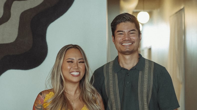 Side Quest’s Cynthia Hoang and Nik Soukavong standing together.
