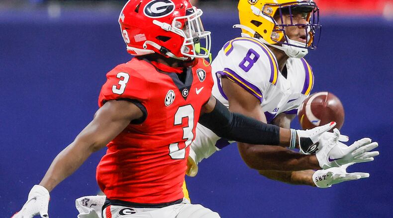 Bulldogs defensive back Kamari Lassiter deflects a pass intended for Tigers wide receiver Malik Nabers during the second half of the SEC Championship game Dec. 3 at Mercedes-Benz Stadium. (Jason Getz / Jason.Getz@ajc.com)