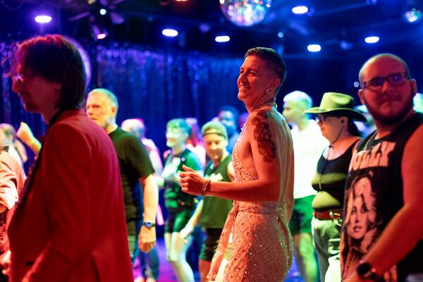 Maha Taylor dances at DanceOut’s Dolly Parton themed line dancing event at the Heretic on Aug. 27, 2026. (Frankie Cole for the AJC)