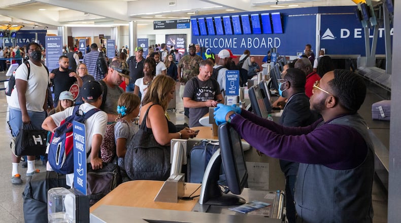 Passengers check in for Delta flights in the domestic terminal of Hartsfield-Jackson Atlanta International Airport on Wednesday, June 29, 2022. (Chris Day/Christopher.Day@ajc.com)