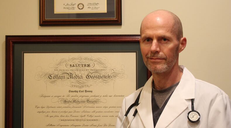 Dr. Timothy Young is resigning after working at Augusta State Medical Prison for 16 years. He said he is giving up the $191,000-a-year post because he faced hostility after raising concerns about security, sanitation and inmate care.