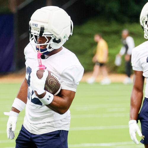 Georgia Tech running back Justice Haynes (22), left, holds the ball during the first day of football practice at Rose Bowl Field and the Mary and John Brock Football Practice Facility, Monday, August 3, 2025, in Atlanta. (Miguel Martinez/AJC)