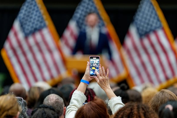 A member of the community takes a video during a Town Hall conducted by U.S. Sen. Jon Ossoff on Friday, April 25, 2025, in Atlanta, at Cobb County Civic Center. (Atlanta Journal-Constitution/Jason Allen)
