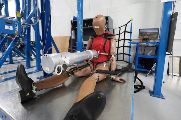 A THOR-5F female crash test dummy is shown on an impact rig at Humanetics in Farmington Hills, Mich., Tuesday, June 10, 2025. (AP Photo/Paul Sancya)