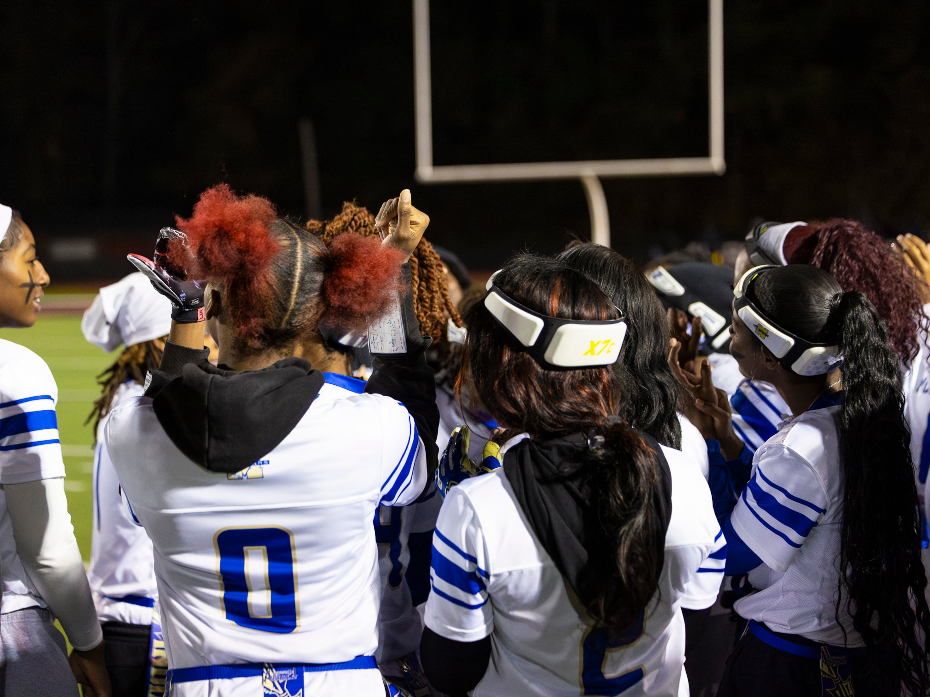 The McEachern flag football team celebrates after their win over Marietta at Osborne High School in Marietta, GA on Monday, November 17th, 2025. (Oscar Guevara Saenz for the AJC)