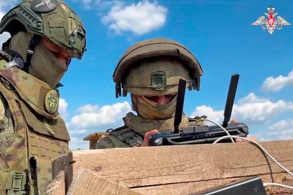 In this photo taken from video distributed by the Russian Defense Ministry Press Service on Monday, May 26, 2025, Russian serviceman train to operate military drones in an undisclosed location. (Russian Defense Ministry Press Service via AP)