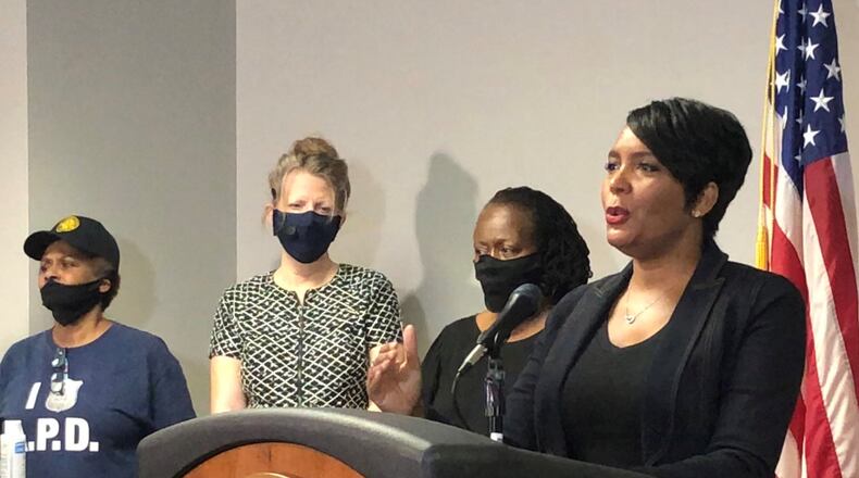 Atlanta Mayor Keisha Lance Bottoms, right, speaks during a press conference at Atlanta police headquarters about the Saturday night shooting death of 8-year-old Secoriea Turner. J. SCOTT TRUBEY/SCOTTl.TRUBEY@AJC.COM