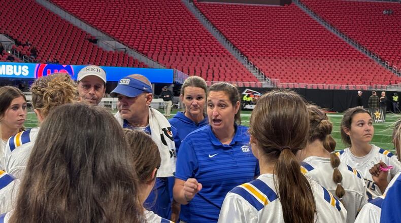 Southeast Bulloch coach Marci Cochran talks to her players during the Division 1 championship game on Dec. 16 at Mercedes-Benz Stadium. Southeast beat Columbus 13-6 in overtime to win its fourth consecutive state championship.