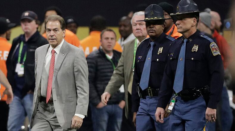 Alabama head coach Nick Saban walks on the field before the NCAA college football playoff championship game between Georgia and Alabama Monday, Jan. 8, 2018, in Atlanta. (AP Photo/David J. Phillip)