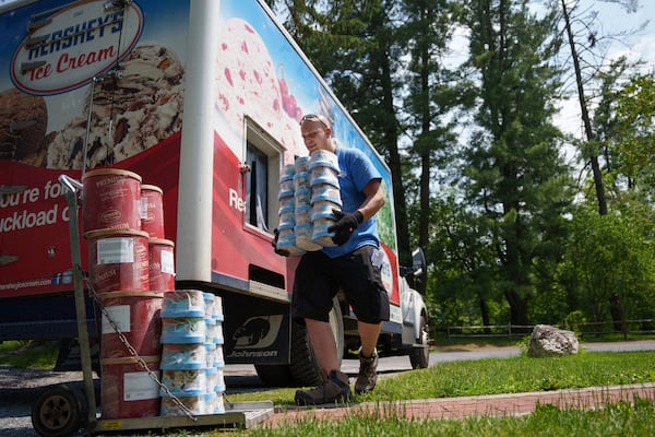 Hershey's Ice Cream delivery driver Sam Sattazahn delivers ice cream to Pine Grove Furnace general store, home of the half-gallon ice cream challenge, at Pine Grove Furnace State Park in Pennsylvania on Tuesday, June 10, 2025.(AP Photo/Mingson Lau)