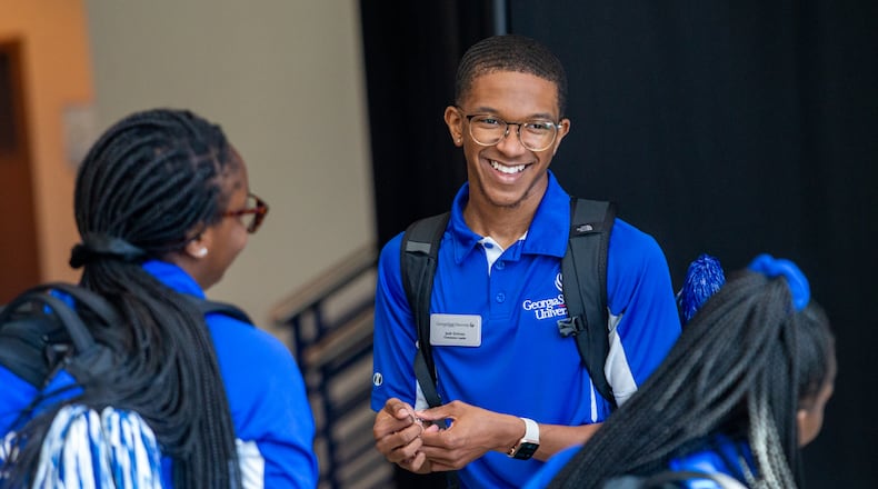 Orientation Leader Josh Grimes gathers with other Georgia State University student leaders during orientation for more than 150 incoming students Wednesday, June 23, 2021. Parents and students are presented with school standards and matched with student orientation leaders for group tours of the campus. Students move to campus in August. (Jenni Girtman for The Atlanta Journal-Constitution)