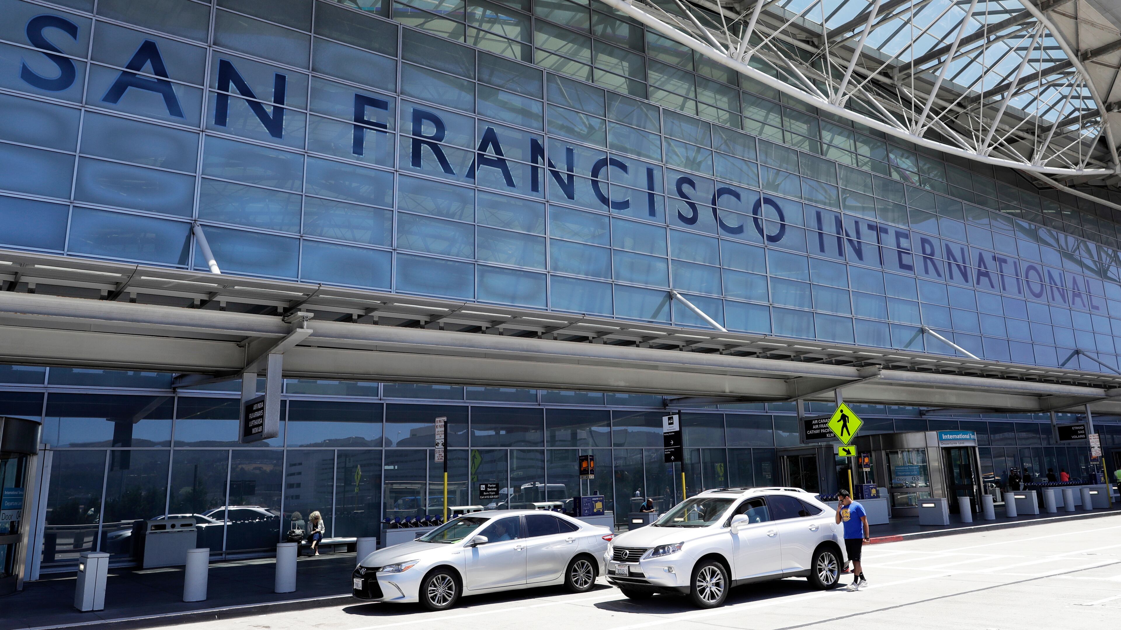 FILE - Vehicles wait outside the international terminal at San Francisco International Airport in San Francisco, July 11, 2017. (AP Photo/Marcio Jose Sanchez, File)