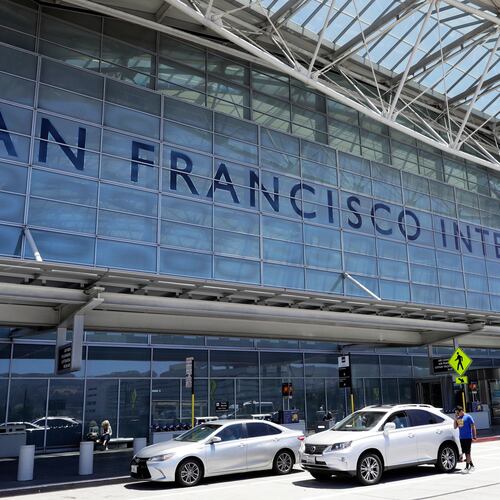 FILE - Vehicles wait outside the international terminal at San Francisco International Airport in San Francisco, July 11, 2017. (AP Photo/Marcio Jose Sanchez, File)