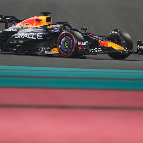 Red Bull driver Max Verstappen of the Netherlands steers his car during the qualifying session ahead of the Formula One Abu Dhabi Grand Prix at the Yas Marina Circuit in Abu Dhabi, UAE, Saturday, Dec. 6, 2025. (AP Photo/Altaf Qadri)