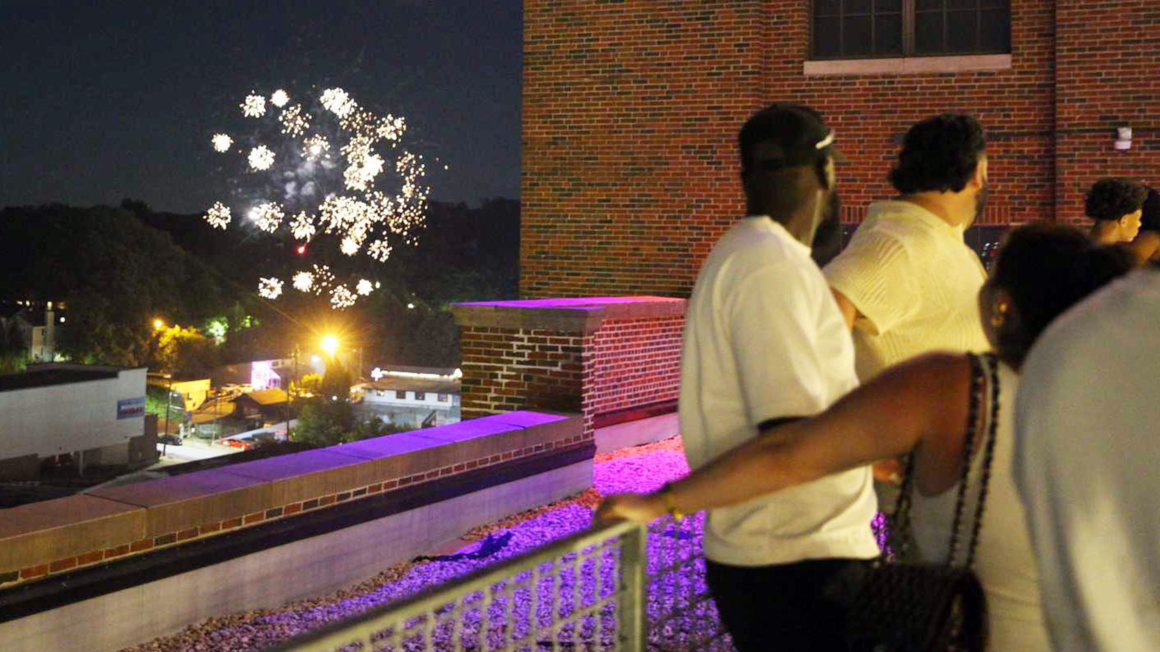 Customers view fireworks from atop the Ponce City Market on Friday, July 4, 2025. (Zaire Breedlove/AJC)