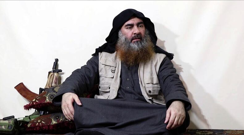 This file image made from video posted on a militant website April 29, 2019, shows the leader of the Islamic State group, Abu Bakr al-Baghdadi, being interviewed by his group's Al-Furqan media outlet.