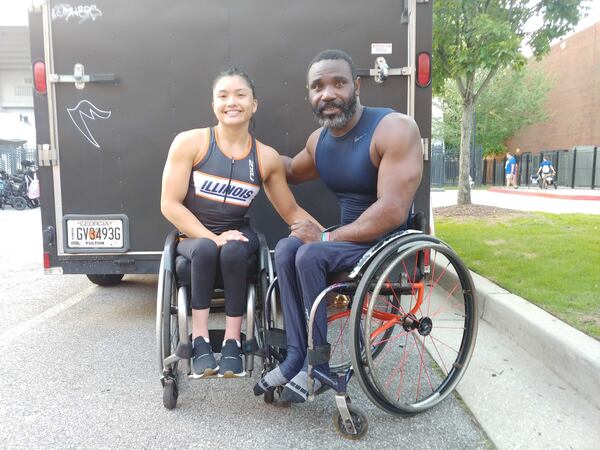 Wheelchair racers Yen Hoang and Raphael Botsyo came from Illinois to attend the Atlanta Journal-Constitution Peachtree Road Race in Atlanta on Monday, July 4, 2022.