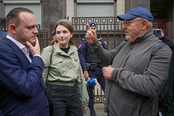 Russian Politician Boris Nadezhdin, right, gestures while speaking to Vladislav Davankov, deputy Chairman of the State Duma in front of The State Duma, the lower house of the Russian Parliament prior a session to consider the third and final reading a bill, criminalising the search of "extremist materials" in Moscow, Russia, Tuesday, July 22, 2025. (AP Photo/Alexander Zemlianichenko)