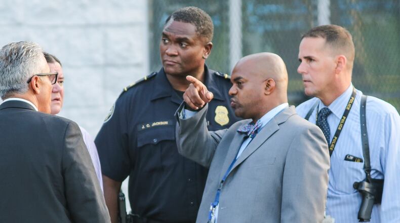 Atlanta homicide investigators were on the scene of fatal shooting in the 2500 block of Donald Lee Hollowell Parkway on Thurs., Aug. 27, 2015. JOHN SPINK / JSPINK@AJC.COM