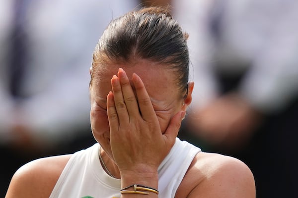 Amanda Anisimova of the U.S. reacts after losing the women's singles final match against Iga Swiatek of Poland at the Wimbledon Tennis Championships in London, Saturday, July 12, 2025.(AP Photo/Kirsty Wigglesworth)
