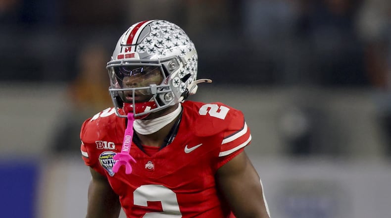 Ohio State safety Caleb Downs (2) prepares between plays during the Cotton Bowl College Football Playoff semifinal game against Texas, Friday, Jan. 10, 2025, in Arlington, Texas. (AP Photo/Gareth Patterson)